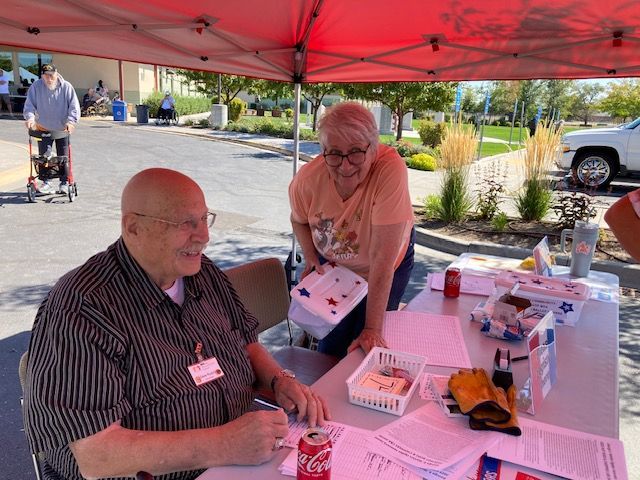 Dave and Cindy volunteers at George E Wahlen Ogden Veterans Home did registration for the car show. 